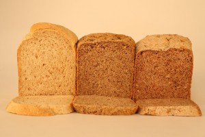Figure 1: The loaf of the left is the optimised HHB$1.5 loaf. The loaf in the middle is the optimised HHB$3 loaf which is high in ground linseed. The loaf on the right is one that is high in walnut (but which was subsequently excluded from further study due to its relatively high cost at NZ$5). All loaves made in a home bread-making machine (Photography: Pascale Otis).